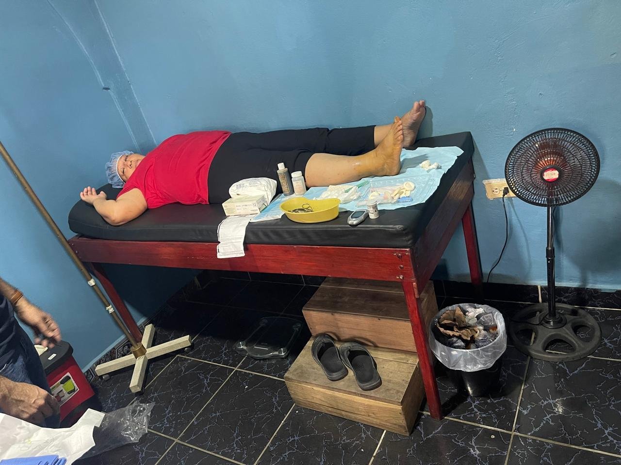 The partner clinic in Peña Blanca: a patient rests on the exam table while supplies sit ready.