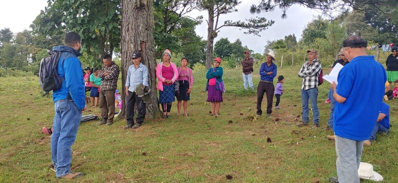 Lenca neighbors with no church building, hearing the Word of God under the trees.